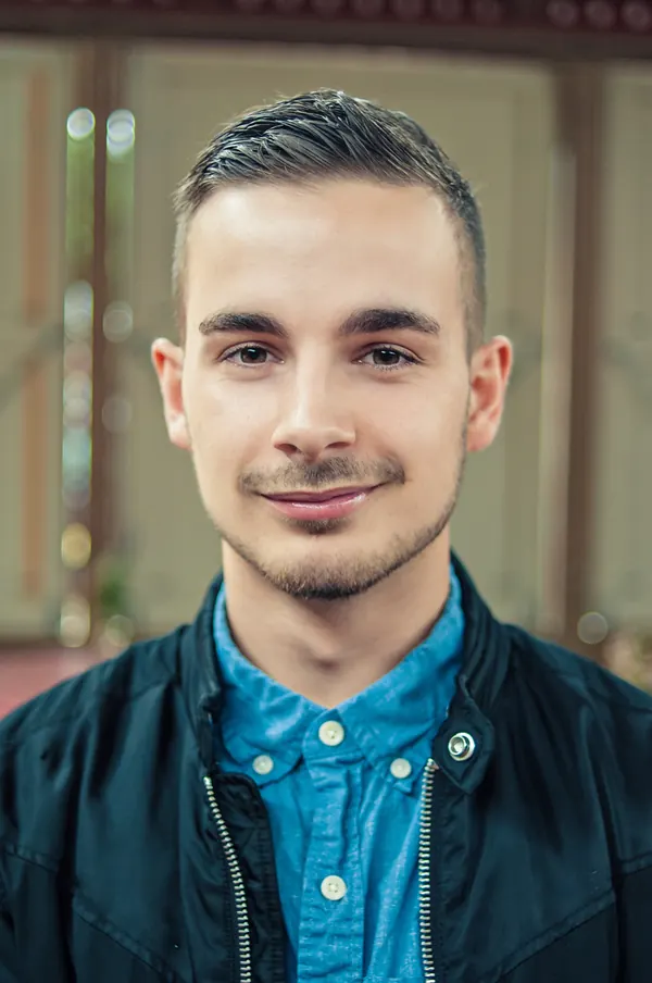 Portrait of a young man in a dark jacket